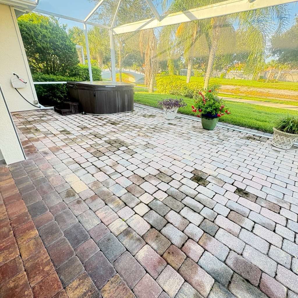 Stained lanai pavers before pressure washing — SW Florida