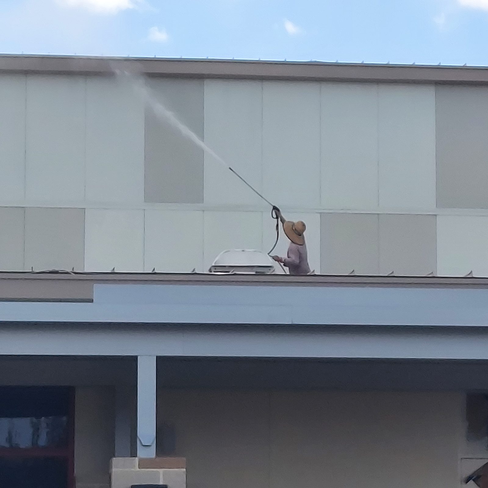 Blastmasters crew cleaning community tile roof