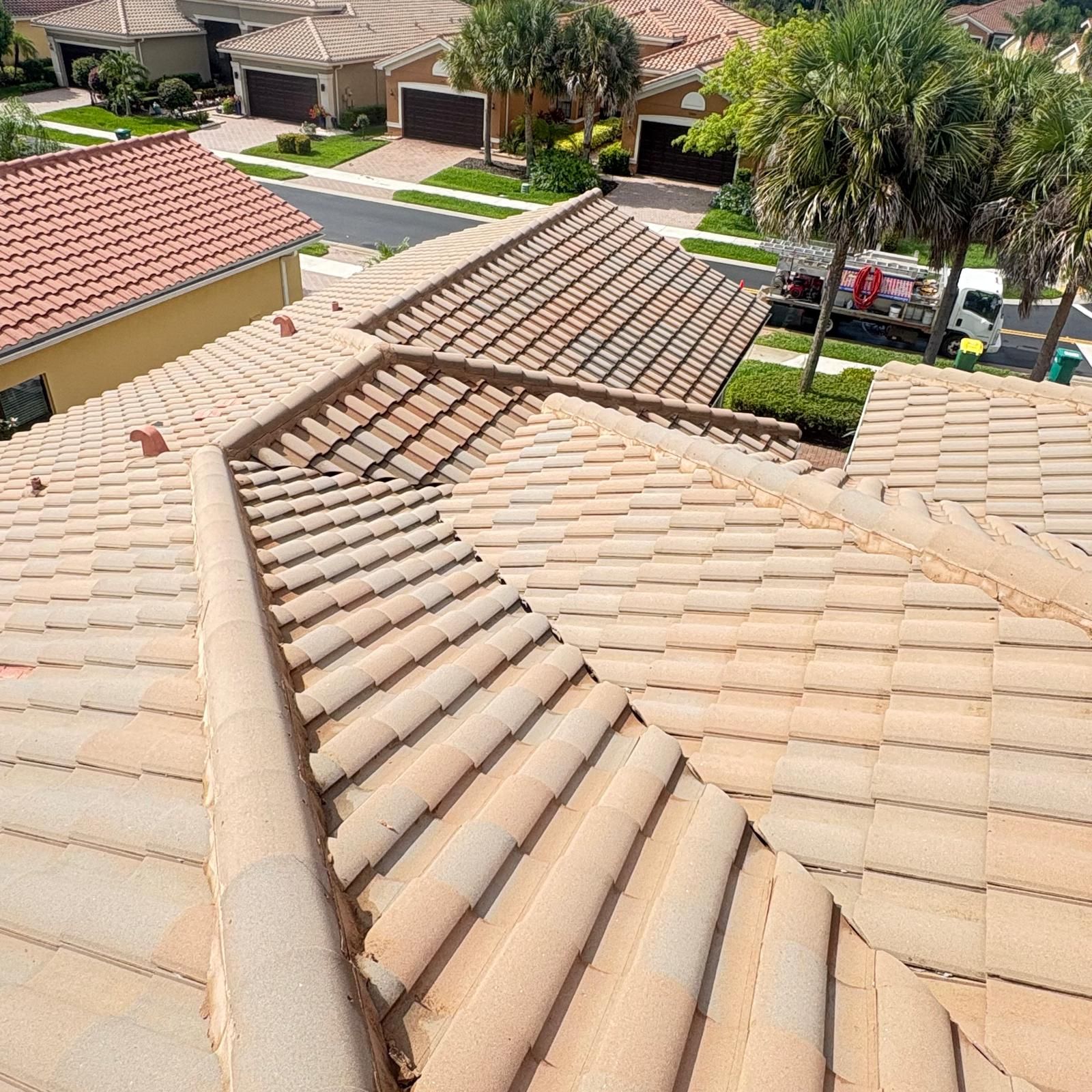 Clean tile roof after pressure washing — HOA community SW Florida